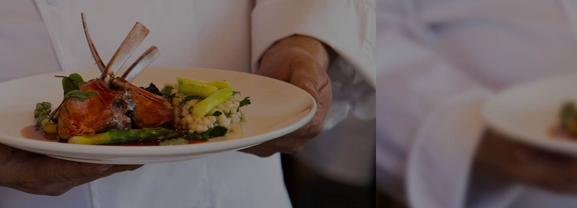 Chef holding plate of food
